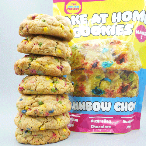 The Dough Parlour Rainbow Choc cookie premix bag with vibrant chocolate chip cookies.