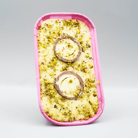 Pistachio Cookie Boat by The Dough Parlour: soft-baked cookie with pistachio ganache, crushed pistachios and a halved Lindt pistachio truffle in a pink paper boat