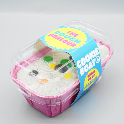 Cookie Monster Cookie Boat sealed in its clear-lid gift packaging with The Dough Parlour sleeve